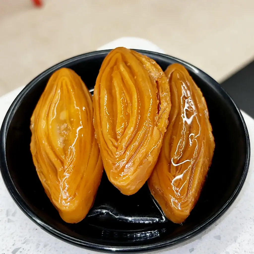 Tapeswaram Kaja – a classic Andhra sweet soaked in sugar syrup, crisp outside and juicy inside from Estaa Sweets, Bangalore