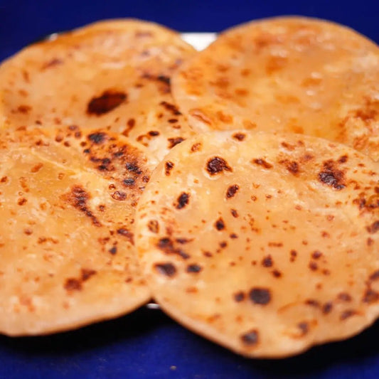 Traditional Andhra Bobbatlu β thin, golden flatbread stuffed with sweet lentil and jaggery filling, roasted with ghee from Estaa Sweets - Bangalore