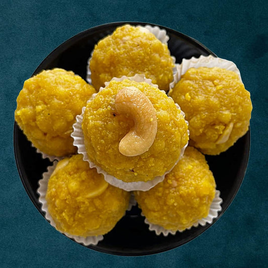 Boondi Laddu – classic Indian sweet made from tiny fried gram flour pearls soaked in sugar syrup and shaped into soft, round laddus, rich in taste and tradition from Estaa Sweets, Bangalore