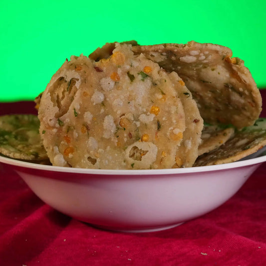 Crunchy Andhra-style Chekkalu made with rice flour, chana dal, and spices – traditional savory snack from Estaa Sweets, Bangalore