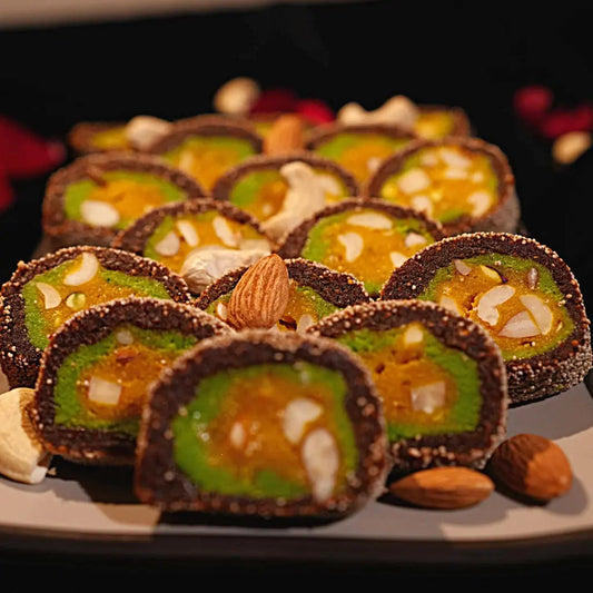 "Kesar Anjeer Roll from Estaa Sweets Bangalore – rich dry fruit sweet made with figs, saffron, and nuts, handcrafted in pure ghee, perfect for festive gifting