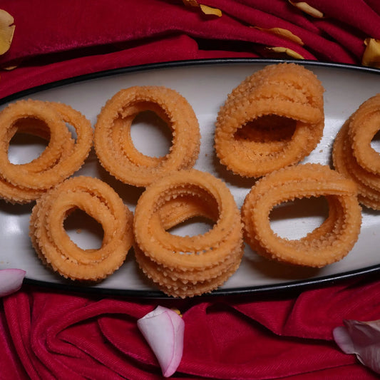 Crispy round murukku made with rice flour and spices, traditional South Indian snack from Estaa Sweets, Bangalore